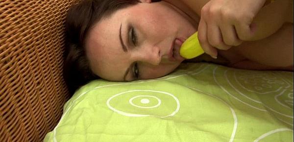  Red-haired slut has fun with banana dildo